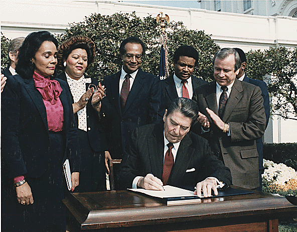 Reagan signs bill to create MLK National Holiday