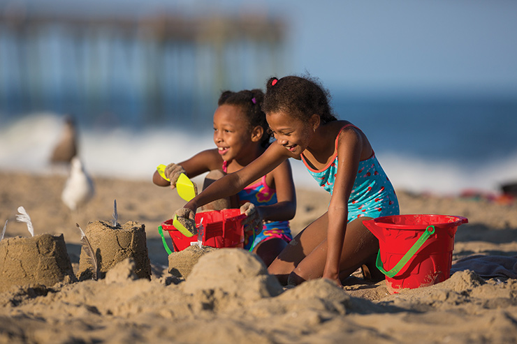 Girls making sand castles on the beach in Ocean City