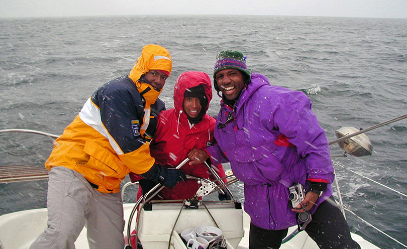 Friends having fun boating on a chilly day in Puget Sound, Seattle