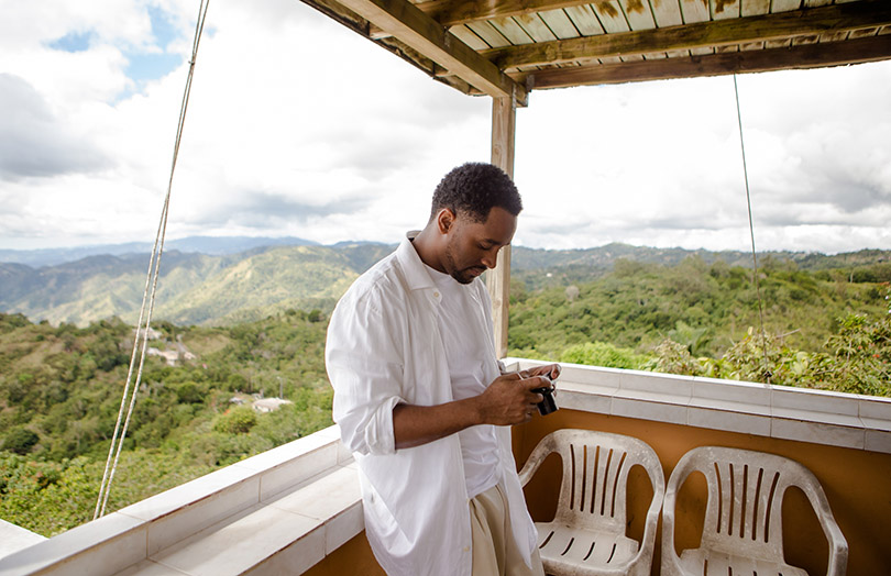 Photographer overlooking El Yunque rainforest