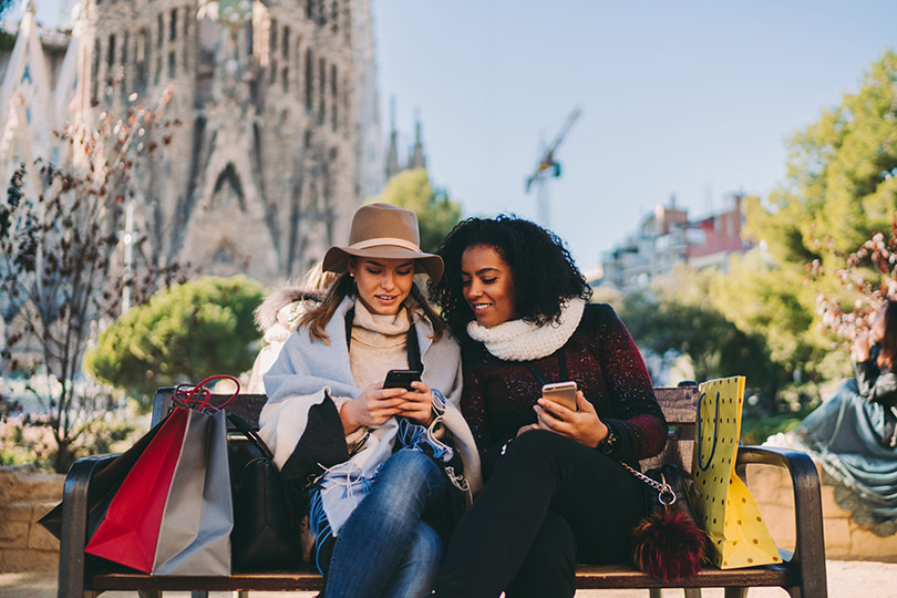 Women texting on a bench near Sagrada Familia, 3 Days In Barcelona