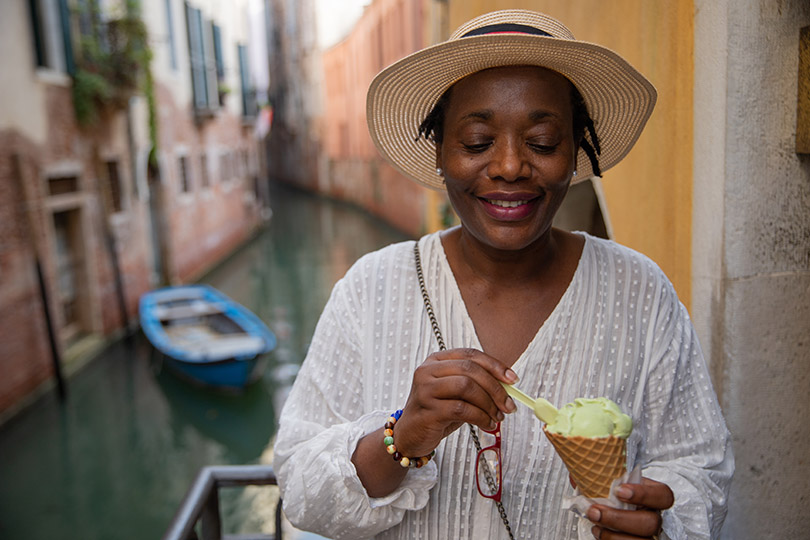 A sister enjoys her gelato in Venice, Black Travel