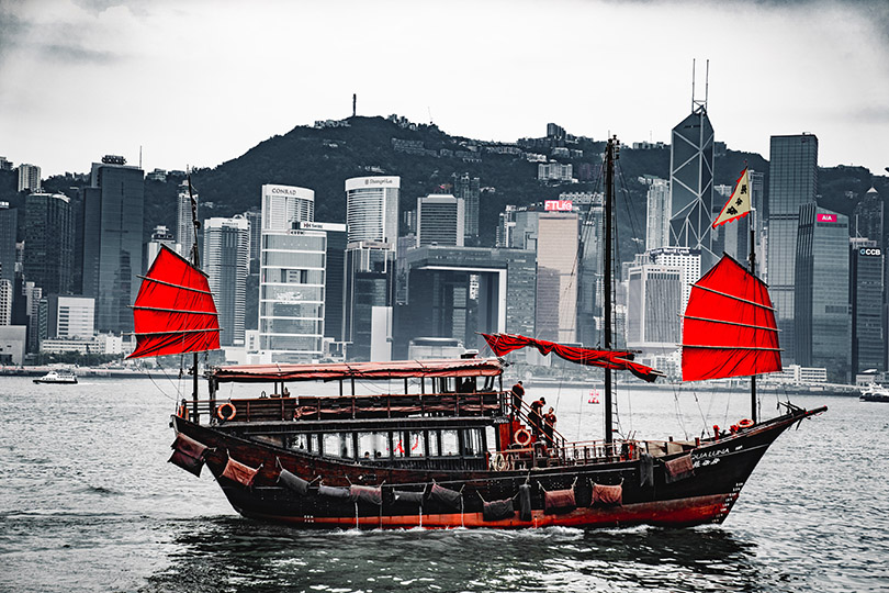 A vintage boat crossing Victoria Harbor, Hong Kong