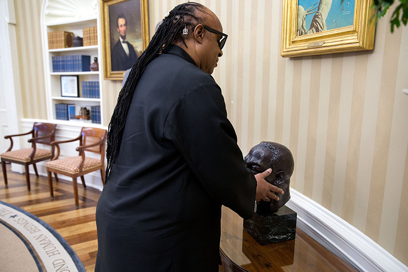 Stevie Wonder touching MLK Bust in the Oval Office; credit Lawrence Jackson/White House