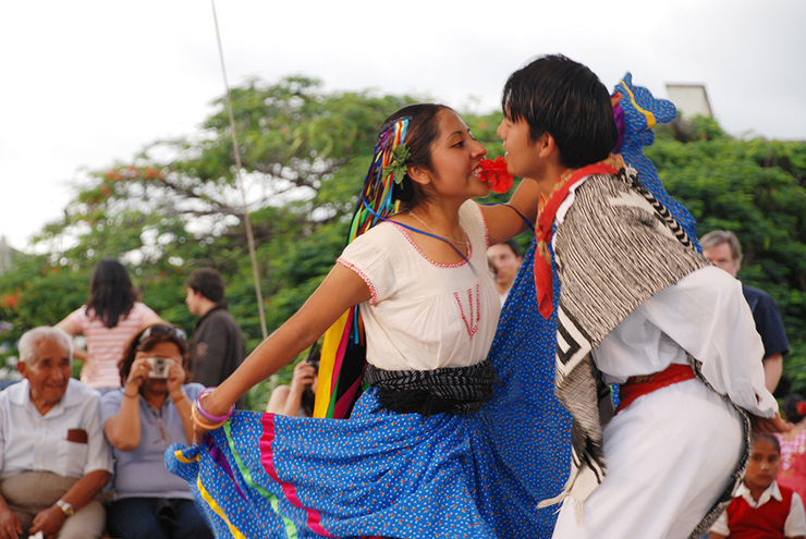 Two young people dancing a jarabe in Oaxaca