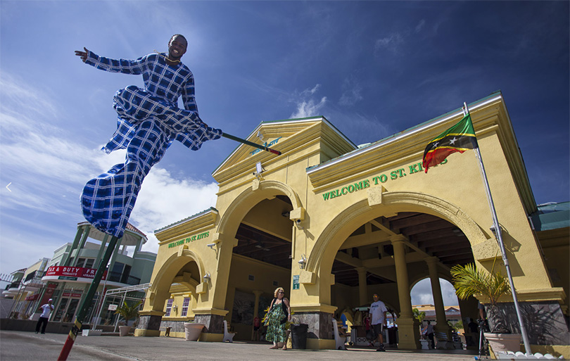 St. Kitts man on Mocko-Jumpie welcomes you at the port; credit St. Kitts Tourism