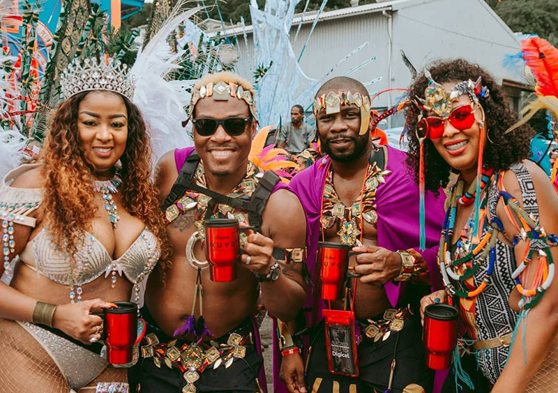 Mugs in hand, ready for St. Lucia Carnival; credit St. Lucia Tourism